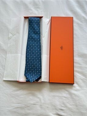 Hermes blue silk tie with skating penguin motif